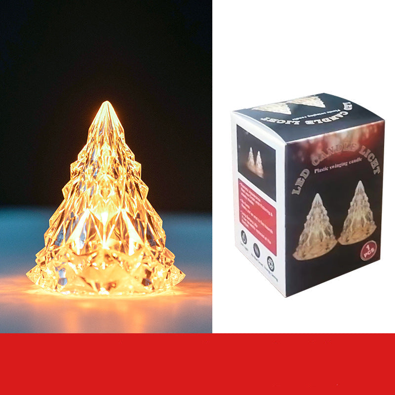 Decorative LED light shaped like a pyramid and its packaging on a white background.